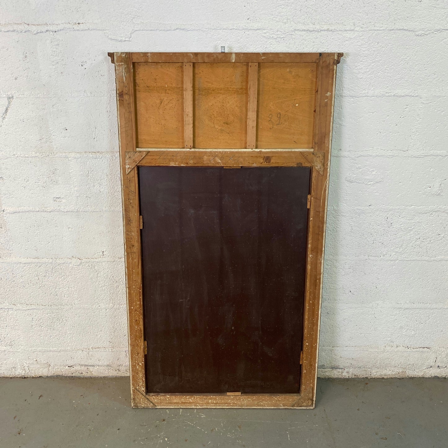 Grand miroir trumeau biseauté doré