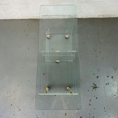 Grande table basse en verre à roulette