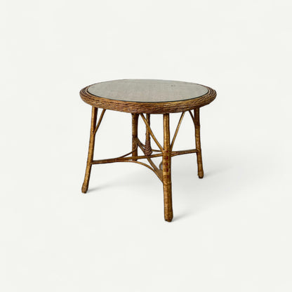 Table ronde en rotin tressé et plateau en verre