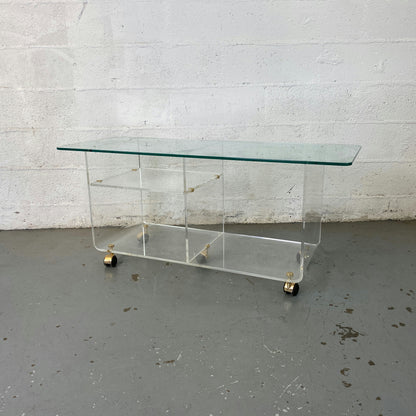 Grande table basse en verre à roulette